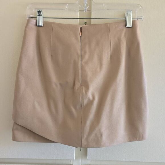 High waisted skort in soft beige leather has a hidden short under a high-low ski - Picture 5 of 7